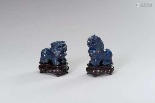 A PAIR OF LAPIS LAZULI FIGURES OF BUDDHIST LIONS