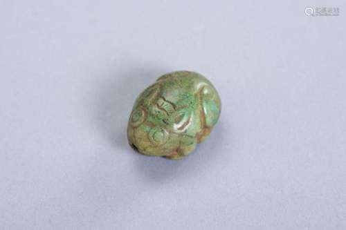A TURQUOISE PENDANT DEPICTING A HARE