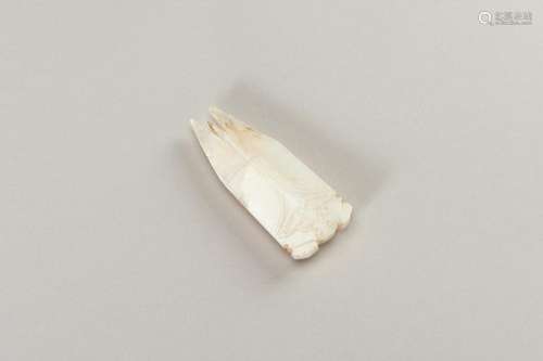 A HAN-STYLE ARCHAISTIC WHITE JADE OF A CICADA