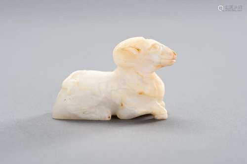 A WHITE JADE MINIATURE CARVING OF A RAM