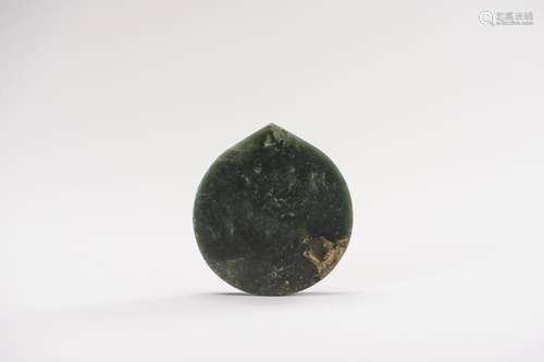 A SPINACH GREEN JADE ORNAMENT