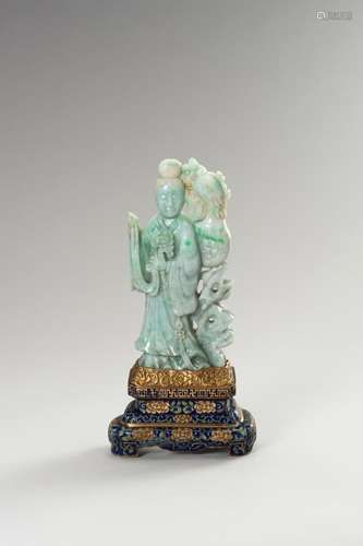 A JADEITE FIGURE OF GUANYIN ON A CLOISONNÉ BASE