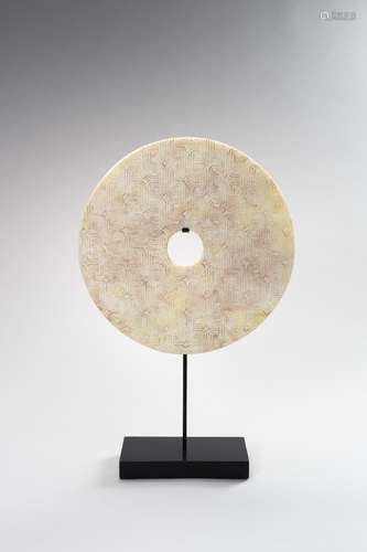 A CARVED CELADON JADE BI DISC