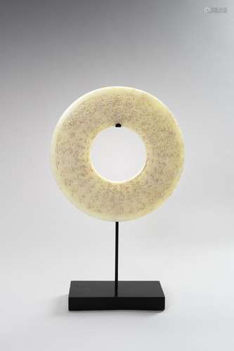 A CARVED CELADON JADE BI DISC