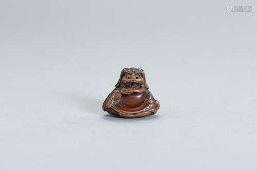 A FINE WOOD NETSUKE OF A SHISHIMAI DANCER