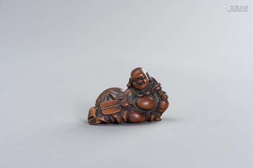 A WOOD NETSUKE OF HOTEI