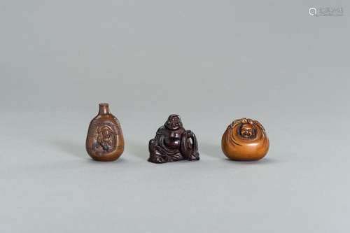 A GROUP OF THREE WOOD NETSUKE OF HOTEI AND DAIKOKU