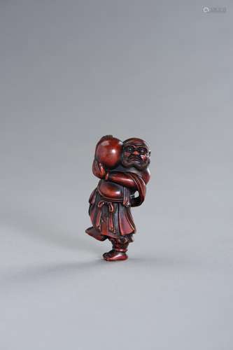 A LARGE RESIN NETSUKE OF AN ISLANDER