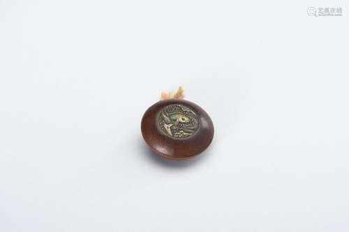 A WOOD KAGAMIBUTA NETSUKE WITH A BRASS LID DEPICTING A CARP