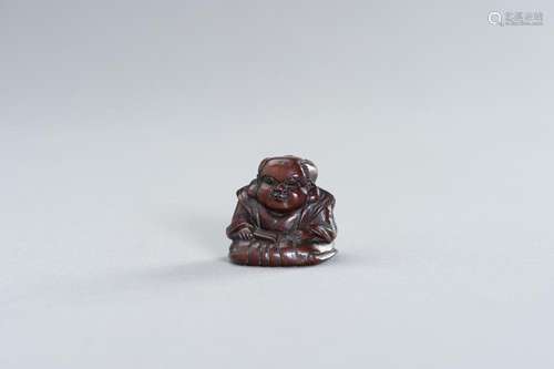 A WOOD NETSUKE OF FUKUSUKE