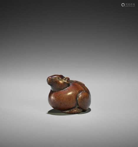 RANKO: A RARE WOOD NETSUKE OF A RAT EMERGING FROM AN EGG