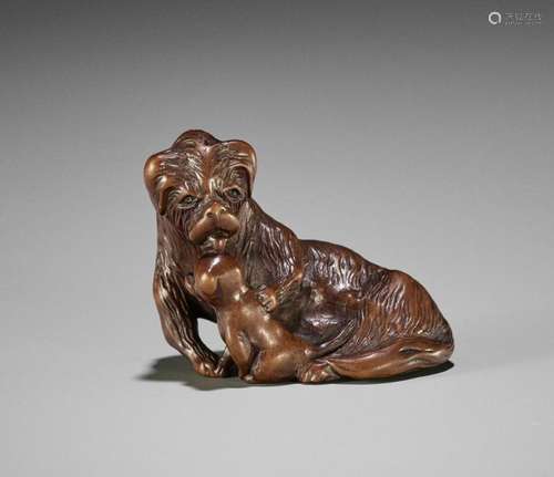 A FINE WOOD NETSUKE OF A SHAGGY DOG WITH PUP