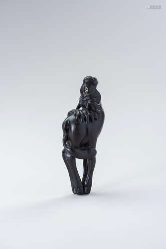 A LARGE EBONY WOOD NETSUKE OF A BAYING HORSE