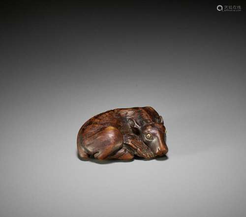 MASATOMO: A FINE WOOD NETSUKE OF A RECUMBENT DEER