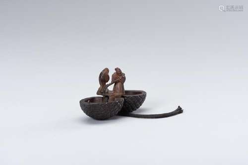 A WOOD KARAKURI NETSUKE OF JO AND UBA INSIDE A PINECONE, ATT...