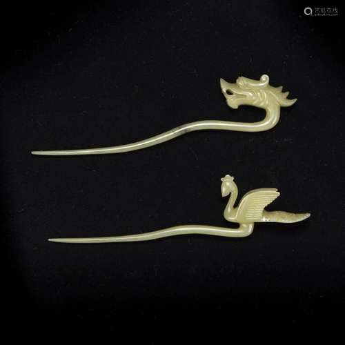 A PAIR OF CARVED JADE 'DRAGON AND PHOENIX' HAIR PI...