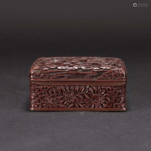 A CARVED SQUARE CINNABAR LACQUER BOX AND COVER