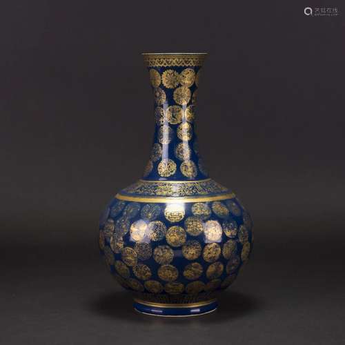 A GILT-DECORATED BLUE GROUND BOTTLE VASE