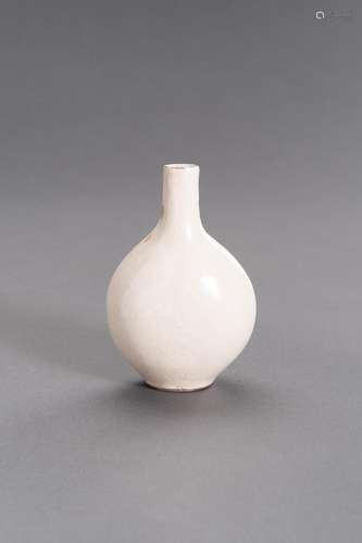 A MOLDED AND CREAM-GLAZED CERAMIC FLASK, MING DYNASTY