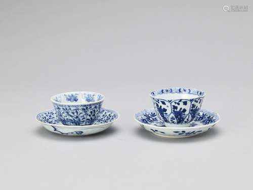 A PAIR OF BLUE AND WHITE PORCELAIN CUPS WITH MATCHING PLATES...