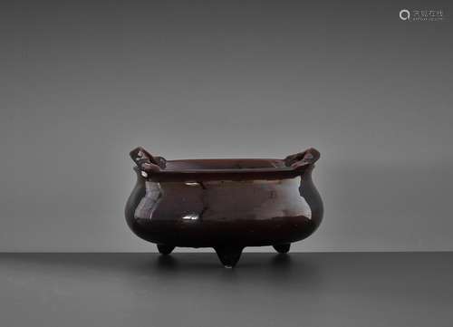 A LARGE AUBERGINE-GLAZED ‘BOMBE’ TRIPOD CENSER, QING DYNASTY