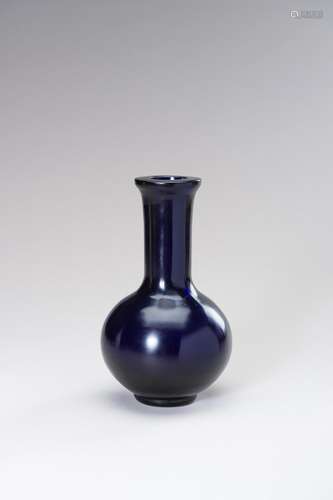 A DEEP BLUE GLASS BOTTLE VASE