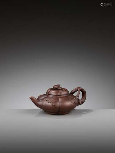 A YIXING ‘BATS AND PEACHES’ LOBED TEAPOT AND COVER, SIGNED W...