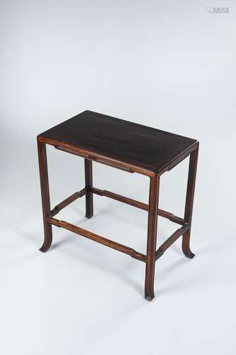 A DARK WOOD SIDE TABLE