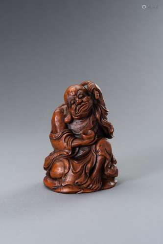 A BAMBOO FIGURE OF UNHAPPY LUCKY BUDDHA