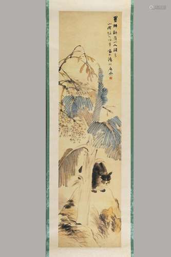 A FINE SCROLL PAINTING OF A CAT BEHIND A TREE