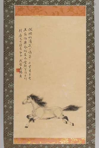 A SCROLL PAINTING OF A GALLOPING HORSE