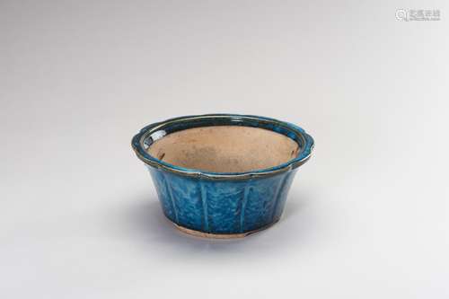 A FLAMBÉ-GLAZED CERAMIC CACHEPOT