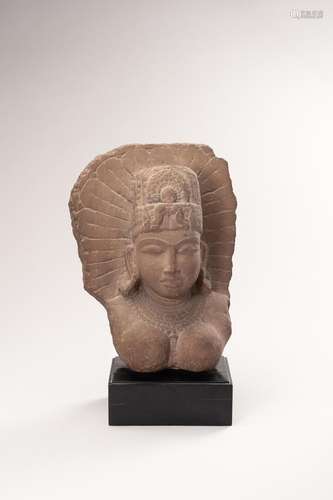 A RED SANDSTONE BUST OF A FEMALE DEITY