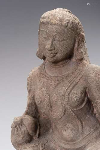 A RED SANDSTONE FIGURE OF A YOUTHFUL FEMALE DEITY