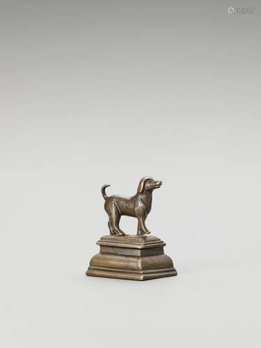 A SOUTH INDIAN MINIATURE BRONZE OF A STANDING DOG, 19th CENT...