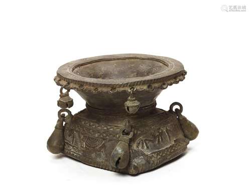 A BASTAR BRONZE OF A MASSIVE BASE WITH BELLS