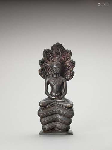 A KHMER STYLE BRONZE OF BUDDHA MUCHALINDA