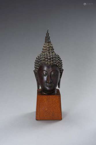 A SUKHOTAI STYLE BRONZE HEAD OF A BUDDHA