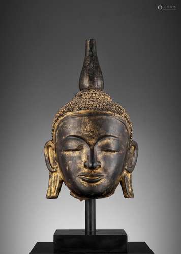 A LARGE GILT AND BLACK-LACQUERED HEAD OF BUDDHA, AVA STYLE