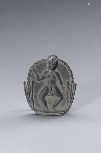 A GRAY SHIST PLAQUE OF A FERTILITY GODDESS