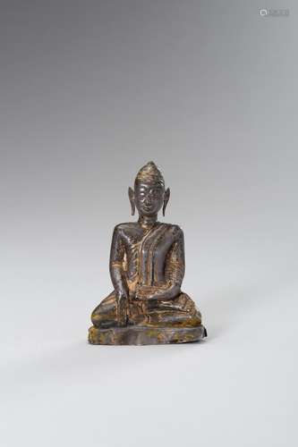 A SILVER REPOUSSE BUDDHA FIGURE