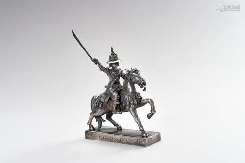 A MASSIVE SILVER FIGURE OF THE LAST BURMESE KING ON HORSEBAC...