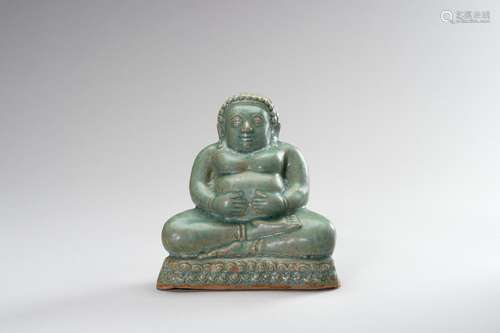 A CELADON-GLAZED FIGURE OF BUDAI