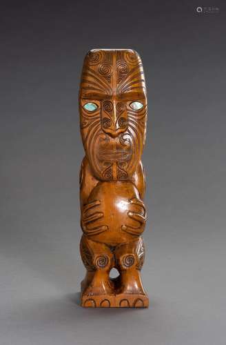 A CARVED MAORI TIKI WOOD FIGURE