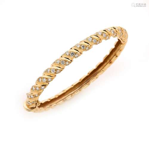 Bracelet jonc ouvrant en or jaune 18K (750/°°), à motifs de ...