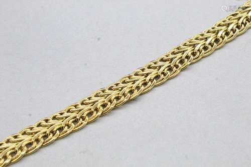 Bracelet en or jaune 18K (750) à maille tressée et en partie...