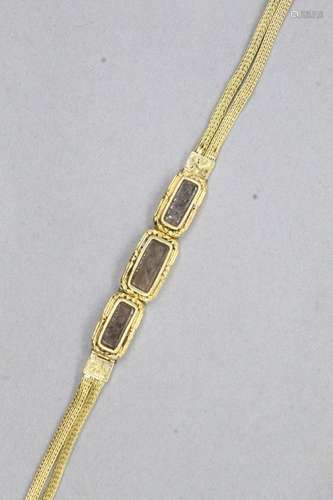 Bracelet en or jaune 18k (750) à deux rangs de mailles palmi...