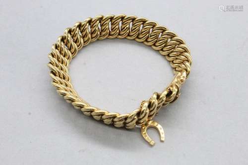 Bracelet en or jaune 18k (750) à maille américaine et une br...