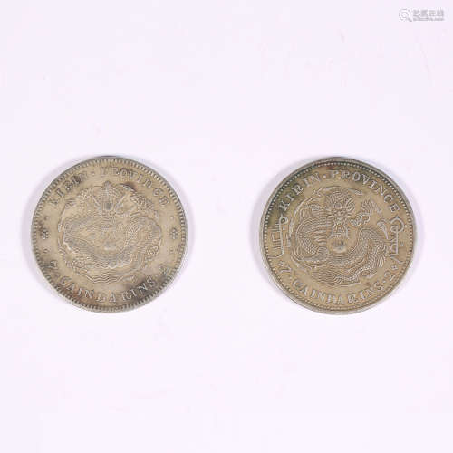 Two silver coins with dragon pattern in Jilin during the Gua...