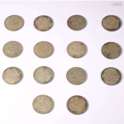 Fourteen  silver coins with dragon pattern during the Guangx...